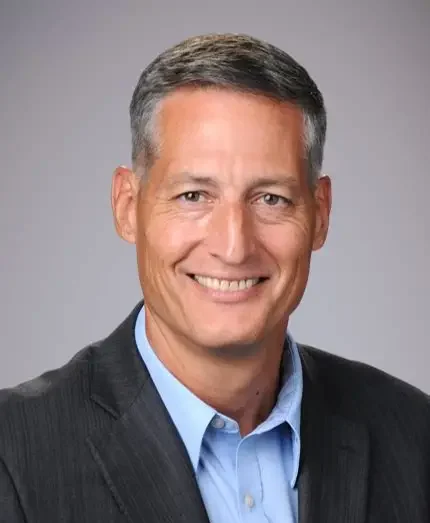 Smiling middle-aged man wearing a suit